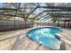 Enclosed in-ground pool with an extensive patio, perfect for outdoor relaxation and private enjoyment at 327 Corona Del Mar St, Lakeland, FL 33809