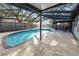 Gorgeous enclosed in-ground pool with a spacious deck, offering a private oasis for summer fun at 327 Corona Del Mar St, Lakeland, FL 33809