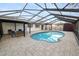 Beautiful enclosed in-ground pool and covered outdoor seating, perfect for relaxation and entertaining at 327 Corona Del Mar St, Lakeland, FL 33809