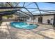 A view of a pristine enclosed in-ground pool with a spacious deck, perfect for a refreshing escape at 327 Corona Del Mar St, Lakeland, FL 33809