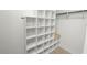 A spacious walk-in closet features built-in shelving and ample storage options at 327 Corona Del Mar St, Lakeland, FL 33809