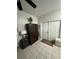 Neutral entryway featuring tile flooring, closet, and a white front door at 389 Nolane Ln, Polk City, FL 33868