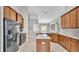 Spacious kitchen showcasing stainless steel appliances and a functional center island at 3978 Viamonte Ln, Lakeland, FL 33810