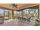 Spacious screened lanai with dining area and outdoor living space to enjoy the beautiful views at 3978 Viamonte Ln, Lakeland, FL 33810