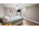 Relaxing bedroom featuring a bed, ceiling fan, and natural lighting at 4075 Davis Rd, Mulberry, FL 33860