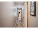 Hallway with wood floors connects various rooms in the home at 4075 Davis Rd, Mulberry, FL 33860