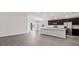 Bright, open-concept space featuring a modern kitchen with stainless steel appliances and an island at 4522 Rapallo Ave, Winter Haven, FL 33884
