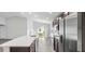 This kitchen has a sleek design with stainless steel appliances and a center island at 4522 Rapallo Ave, Winter Haven, FL 33884