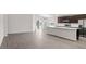 Open floor plan showing stainless steel appliances, ample counter space, and a seamless transition to the living area at 4522 Rapallo Ave, Winter Haven, FL 33884