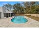 Inviting in-ground pool with concrete deck and screened lanai at 4550 Old Colony Rd, Mulberry, FL 33860