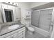 Bathroom featuring a single sink vanity, shower-tub combo and tile flooring at 4550 Old Colony Rd, Mulberry, FL 33860