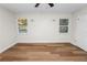 Spacious bedroom featuring wood flooring, natural light and two windows at 4550 Old Colony Rd, Mulberry, FL 33860