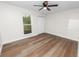 Bedroom featuring wood flooring, natural light, ceiling fan and closet at 4550 Old Colony Rd, Mulberry, FL 33860