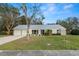 Charming single story home with metal roof, well maintained lawn, and beautiful landscaping at 4550 Old Colony Rd, Mulberry, FL 33860