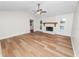 Spacious living room with a fireplace and wood flooring at 4550 Old Colony Rd, Mulberry, FL 33860