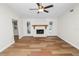 Bright living room with a fireplace and access to the pool at 4550 Old Colony Rd, Mulberry, FL 33860