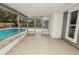 Screened-in patio featuring tiled floors and view of the pool and backyard at 4550 Old Colony Rd, Mulberry, FL 33860