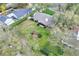 Aerial view of a single-Gathering home with a large backyard and mature trees at 4613 Little Grove Ln, Lakeland, FL 33813