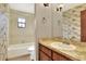 Bathroom featuring nautical-themed wallpaper, and a bath tub with shower at 4613 Little Grove Ln, Lakeland, FL 33813