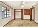 Bedroom features an ample closet, ceiling fan and a large window at 4613 Little Grove Ln, Lakeland, FL 33813