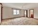 Expansive bedroom showcasing neutral walls and carpet, a ceiling fan, and abundant natural light at 4613 Little Grove Ln, Lakeland, FL 33813