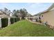 Well-maintained backyard featuring a lush lawn, a pergola, and a fenced-in pool at 4624 Kings Point Ct, Lakeland, FL 33813