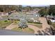 Aerial view of home featuring manicured lawns and a brick driveway at 4624 Kings Point Ct, Lakeland, FL 33813