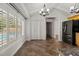 Bright, eat-in kitchen with a view of the pool through the plantation shutters and high vaulted ceiling at 4624 Kings Point Ct, Lakeland, FL 33813