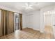 Well-lit room with tile floors, sliding doors, and a closet provides functional living space at 4624 Kings Point Ct, Lakeland, FL 33813