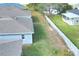 Large backyard enclosed by a white fence with green grass providing ample space for activities and privacy at 477 Kensington View Dr, Winter Haven, FL 33880