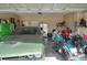 The spacious garage has enough space for parking a car and a motorcycle at 477 Kensington View Dr, Winter Haven, FL 33880