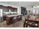 Modern kitchen with dark wood cabinets, stainless steel appliances, and a center island at 477 Kensington View Dr, Winter Haven, FL 33880