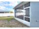 Enclosed screened porch area providing relaxing outdoor views and an enjoyable space for entertaining or relaxing at 477 Kensington View Dr, Winter Haven, FL 33880