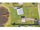 Aerial view of a home with a large backyard leading up to a waterfront with a dock at 5418 Cooper Ln, Fort Meade, FL 33841