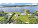 A beautiful aerial view of lakefront properties, lawns, docks, and lush greenery at 5418 Cooper Ln, Fort Meade, FL 33841
