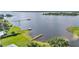 Stunning aerial view of waterfront property featuring multiple docks and a large lake at 5418 Cooper Ln, Fort Meade, FL 33841