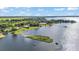 Aerial shot capturing the lakefront properties, each featuring private docks and stunning water views, offering serene living at 5418 Cooper Ln, Fort Meade, FL 33841