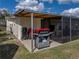 Back patio featuring cooking equipment, connected to house at 5418 Cooper Ln, Fort Meade, FL 33841