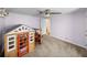 Bedroom with a playhouse and natural lighting through the open doorway at 5418 Cooper Ln, Fort Meade, FL 33841