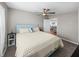 Bedroom features a neutral paint scheme, ceiling fan, and plush carpeting at 5418 Cooper Ln, Fort Meade, FL 33841