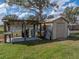 Outdoor utility shed with outdoor sink and tank at 5418 Cooper Ln, Fort Meade, FL 33841