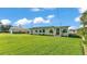 Charming single-story home with well-maintained lawn, lush green grass, and a detached garage on a sunny day at 5418 Cooper Ln, Fort Meade, FL 33841