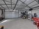 Interior view of detached garage with work and storage space at 5418 Cooper Ln, Fort Meade, FL 33841