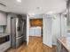 Open view of the laundry room with modern washer and dryer, accessible from the kitchen at 5418 Cooper Ln, Fort Meade, FL 33841