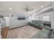 Comfortable living room featuring plush sofas, a neutral rug, and easy access to adjacent rooms at 5418 Cooper Ln, Fort Meade, FL 33841