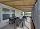 Cozy screened-in patio with comfortable seating, offering a relaxing outdoor living space at 5418 Cooper Ln, Fort Meade, FL 33841