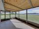 Screened-in porch with water views creating a tranquil retreat for relaxation and enjoying the scenery at 5418 Cooper Ln, Fort Meade, FL 33841