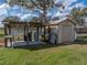 Outdoor shed with covered work area, sink, and utility connections, nestled in a spacious yard at 5418 Cooper Ln, Fort Meade, FL 33841