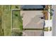 Aerial view of a well maintained roof, backyard, and driveway with manicured landscaping at 5623 Superior Dr, Lakeland, FL 33805