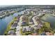 Aerial view highlighting a lakeside residential community with well-maintained homes and winding roads at 5623 Superior Dr, Lakeland, FL 33805